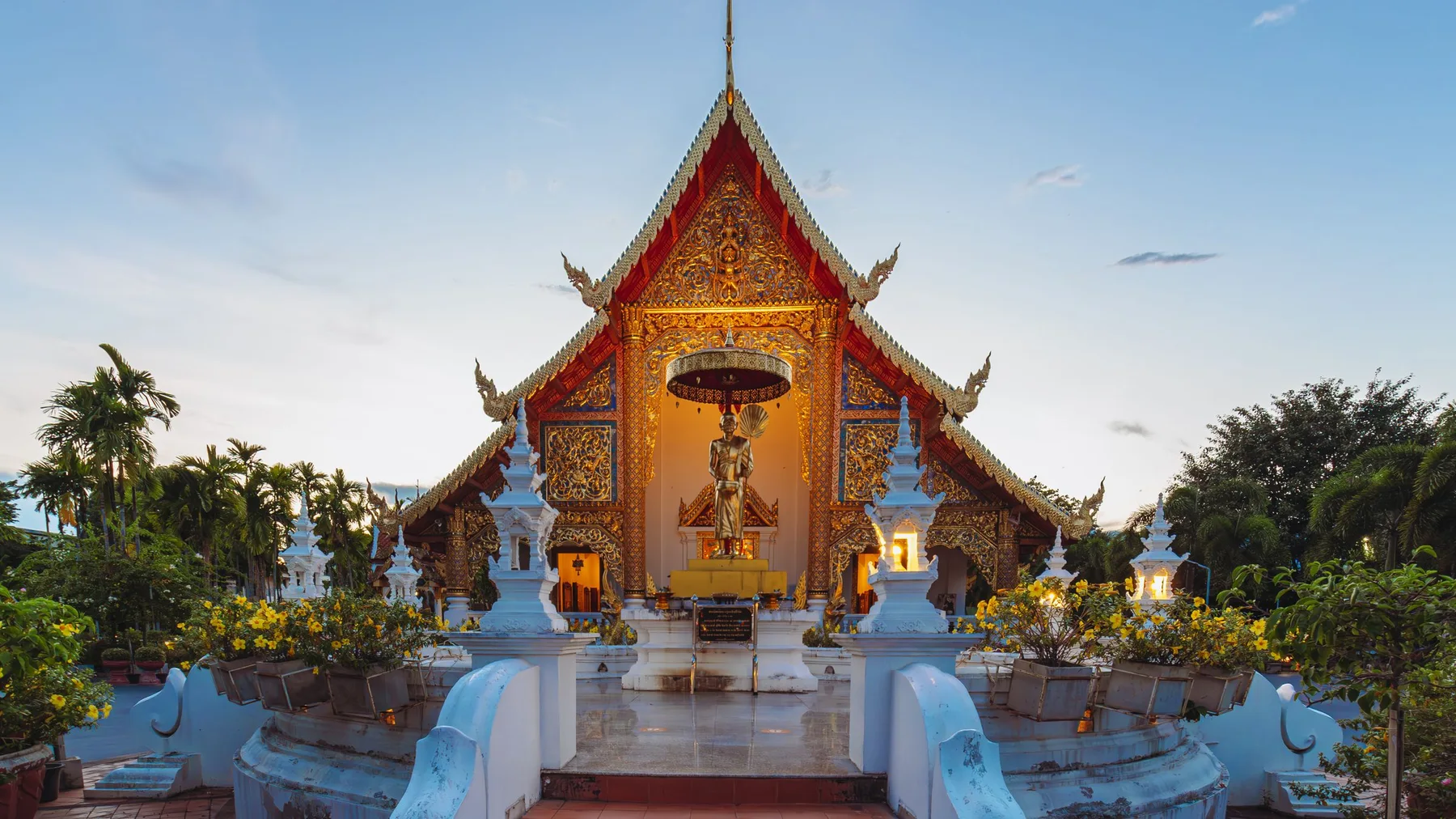 Stunning view of Wat Phra Singh Temple in Chiang Mai, Thailand during twilight.
