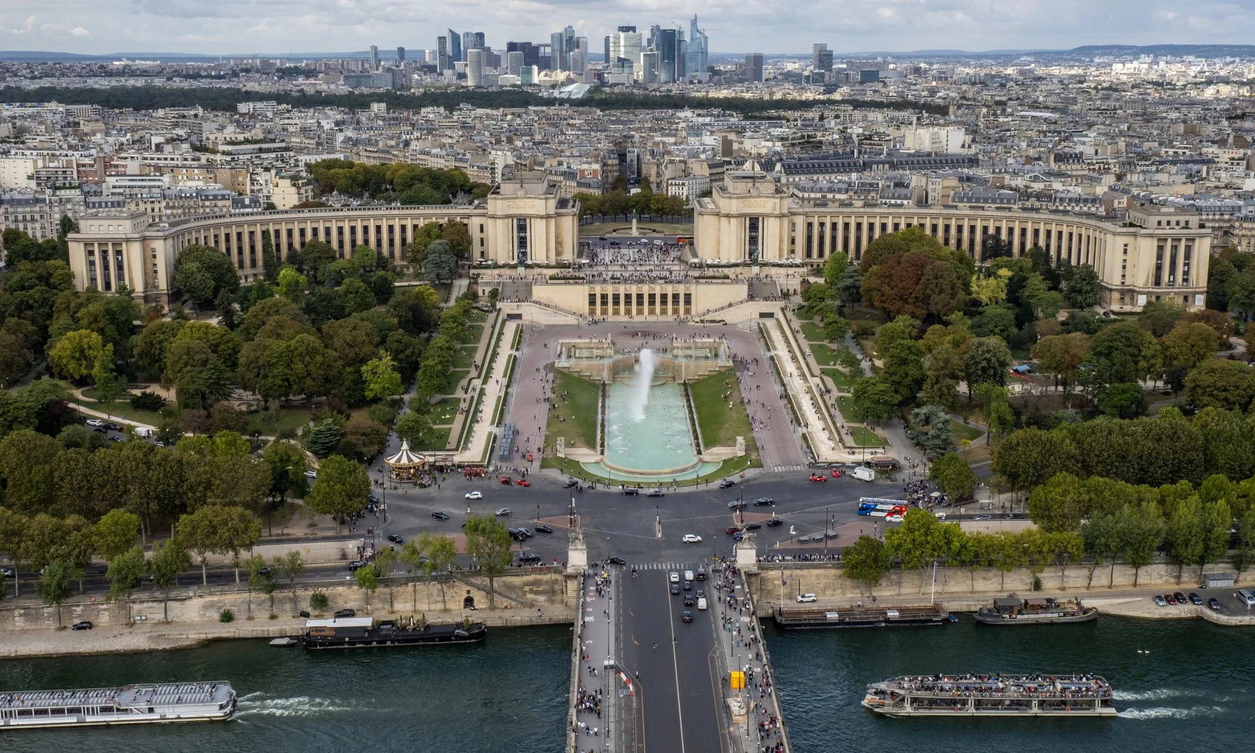 Stunning aerial view of Palais de Chaillot gardens and the La Défense skyline in Paris, France.