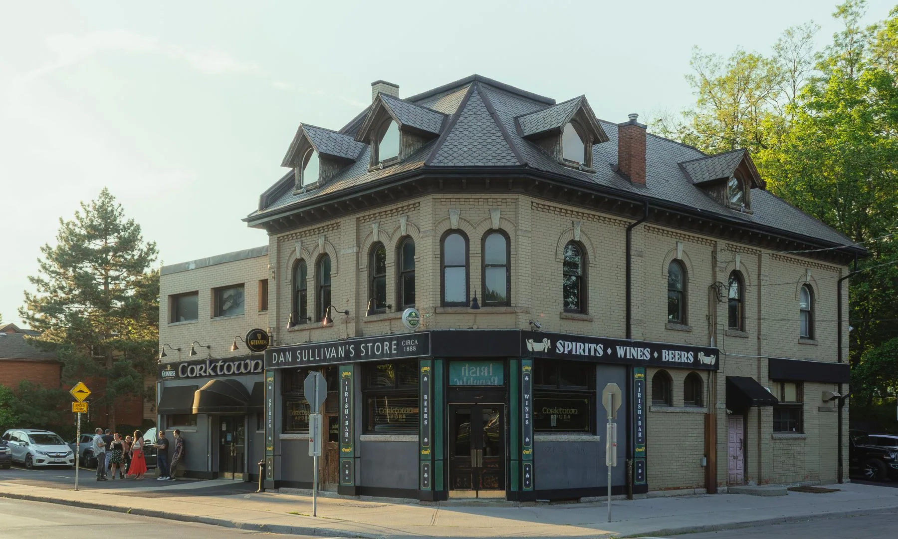 Historic building in Hamilton, ON, bathed in sunlight, showcasing elegant architecture.